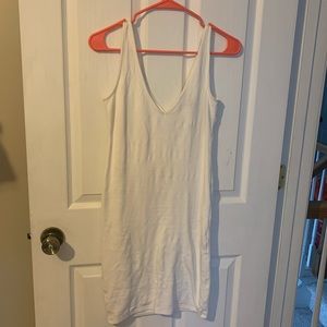 White bodycon dress with V neckline